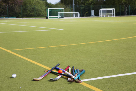 Hockey Sticks And Balls In Fieldの写真素材