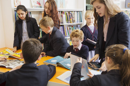 Group Of Students Reading In Library