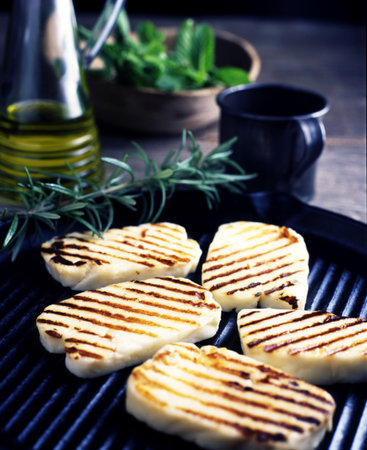 Still Life Of Grilled Haloumi Cheese With Rosemary On Grillの写真素材
