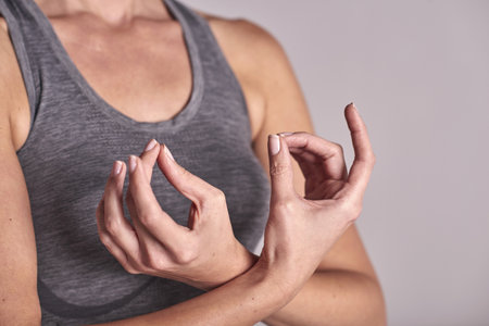 Cropped Shot Of Woman Meditating With Fingers Togetherの写真素材