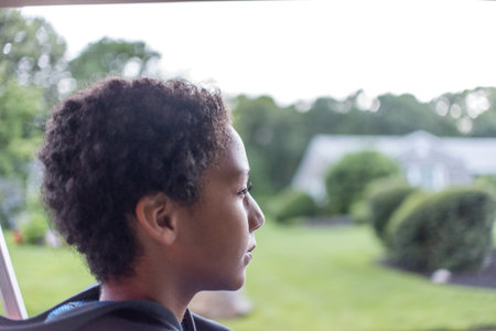 Profile Headshot Of Boy Gazing In Parkの写真素材