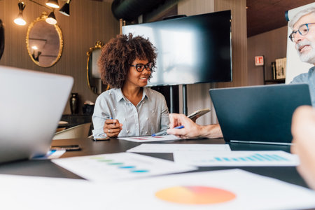 Italy, Business people having meeting in creative studioの写真素材