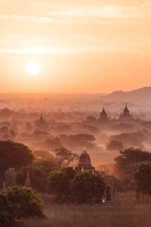 Myanmar, Bagan, view of temples in morning mistの写真素材