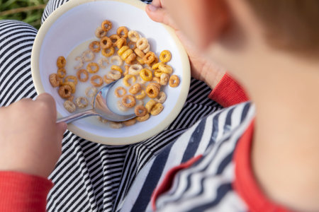Close-up of boy (18-23 months) eating cereal