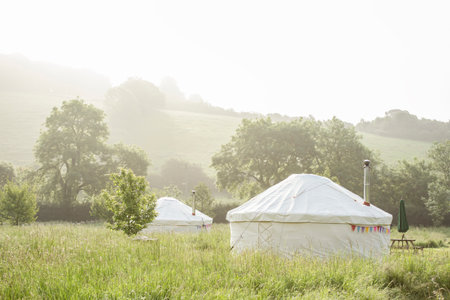 UK, Dorset, Yurts in landscapeの写真素材