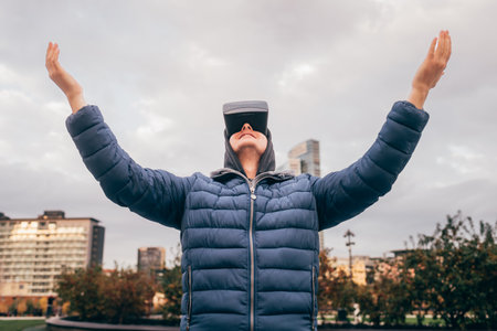 Italy, Man usingÃVRÃgoggles in cityの写真素材