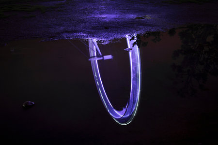 London Eye reflected in puddleの写真素材