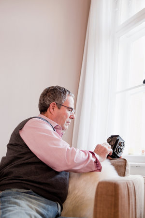 man playing with camera