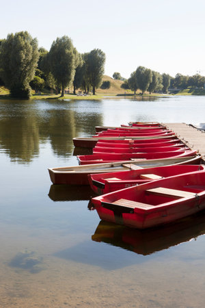 Small boats tied on a jettyの写真素材