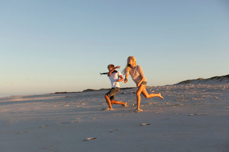 Boy and Girl throwing stonesの写真素材