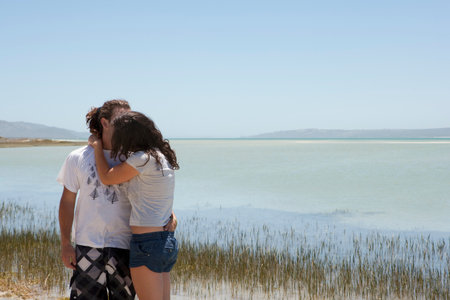 Couple kissing on beachの写真素材