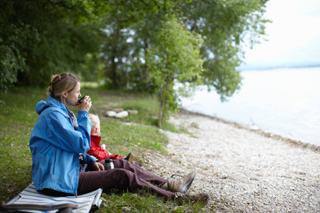 Mother and son drinking tea togetherの写真素材