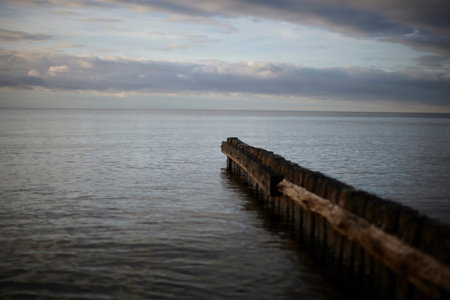 Wooden fence jutting out into lake
