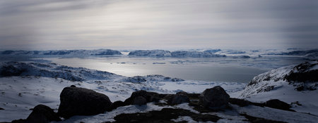 Still lake in snowy landscape