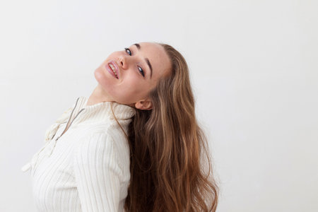 Smiling woman tossing hairの写真素材
