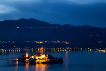 Village on island lit up at nightの写真素材