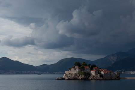 Houses on island in still lakeの写真素材