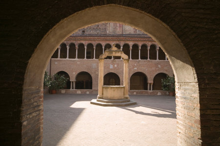 Town well viewed through archwayの写真素材