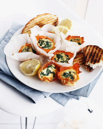 Eggs in salmon cups with toastの写真素材
