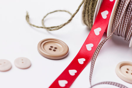 Close up of ribbon, string and buttonsの写真素材