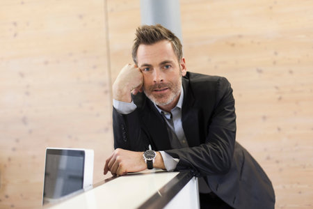 Businessman on counter in office