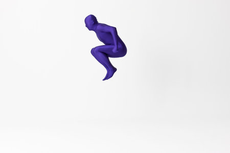 Man in bodysuit jumpingの写真素材