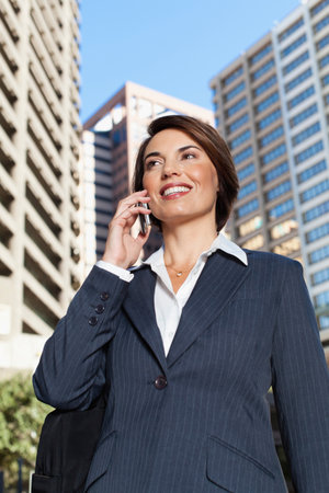 Businesswoman talking on cell phoneの写真素材