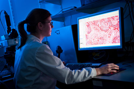 Scientist using computer in lab