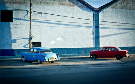 Vintage cars parked on city streetの写真素材