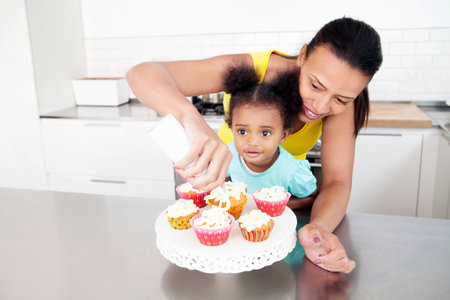 Mother and daughter baking togetherの写真素材