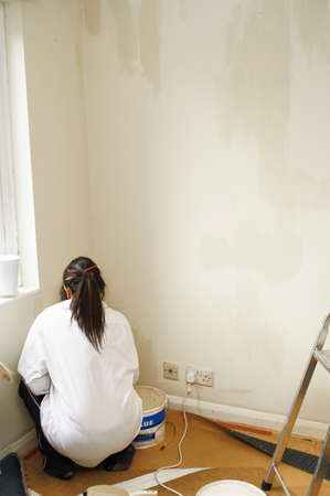 Woman painting roomの写真素材