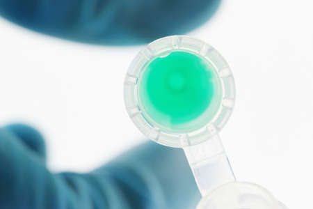 Close up of scientist holding liquid