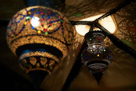 Ornate metal lanterns on ceilingの写真素材