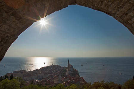 View of coastal city through archwayの写真素材