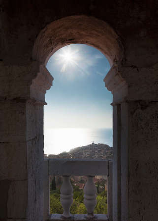 Blue sky viewed through ornate archの写真素材