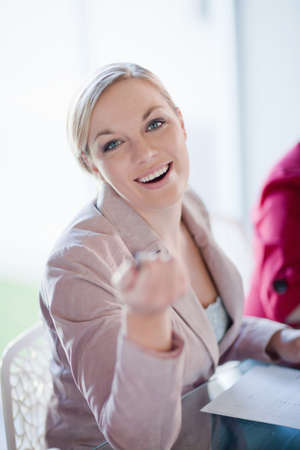 Businesswoman talking in meetingの写真素材