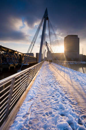 Snow on urban foot bridgeの写真素材