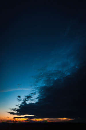 Sun setting over rural landscapeの写真素材