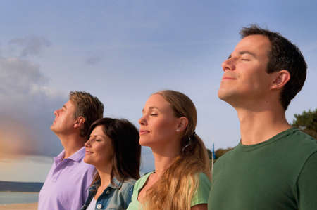 Couples relaxing together outdoorsの写真素材