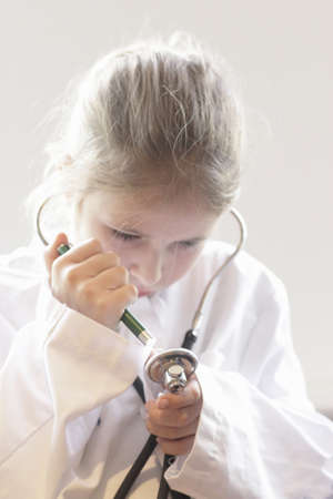 Girl playing doctor with stethoscopeの写真素材