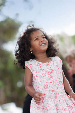 Smiling girl walking outdoorsの写真素材