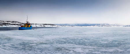 Fishing boat in glacial waters