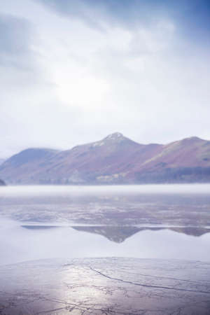 Layer of ice on rural lakeの写真素材