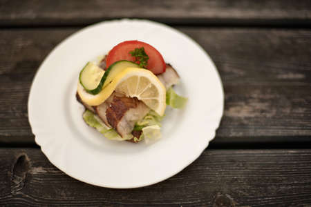 Plate of fish with vegetables