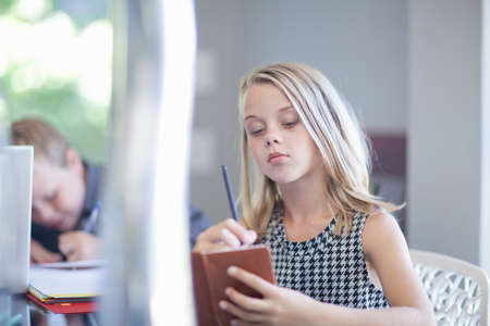 Girl playing businesswoman at desk