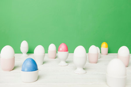 Colorful Easter eggs in egg cupsの写真素材