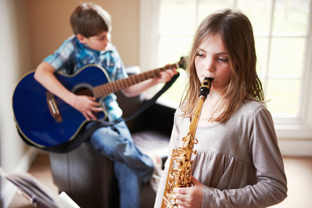 Children playing music togetherの写真素材