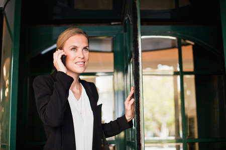 Businesswoman talking on cell phoneの写真素材
