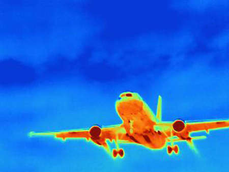 Thermal image of airplane in sky