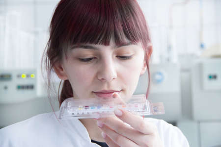 Scientist examining samples in lab